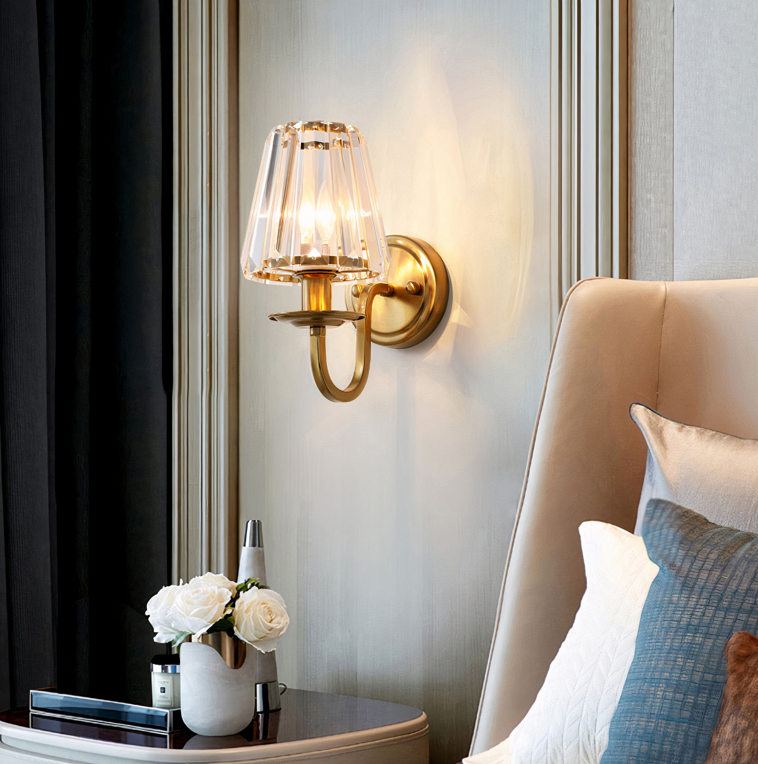 Living room view the contemporary crystal wall light in brass from Elumin.