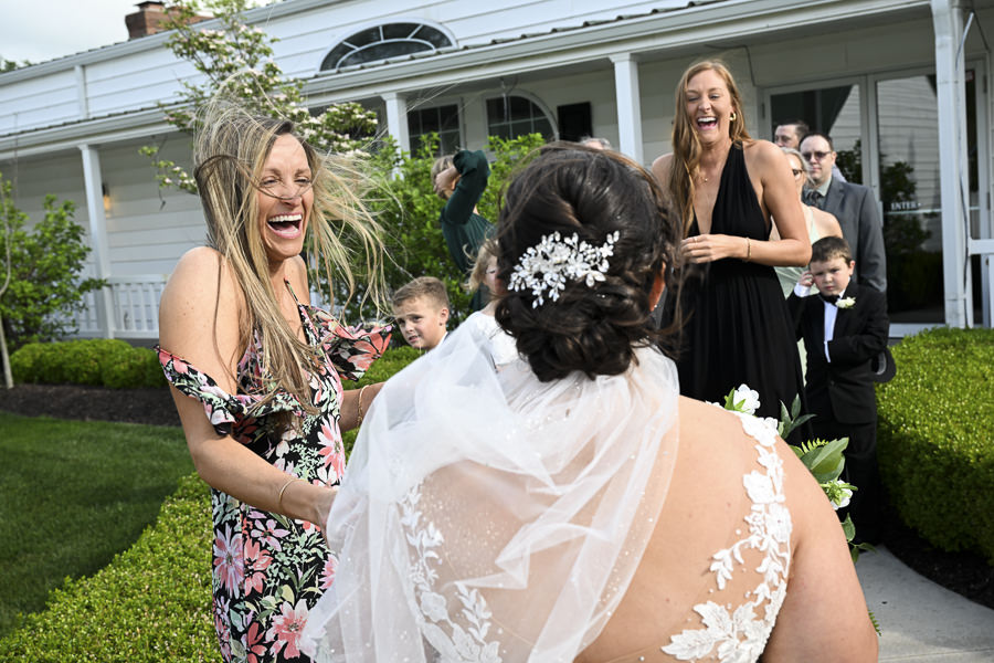 2 friends of the bride happy to see the bride during a wedding at Lone Summit Ranch.