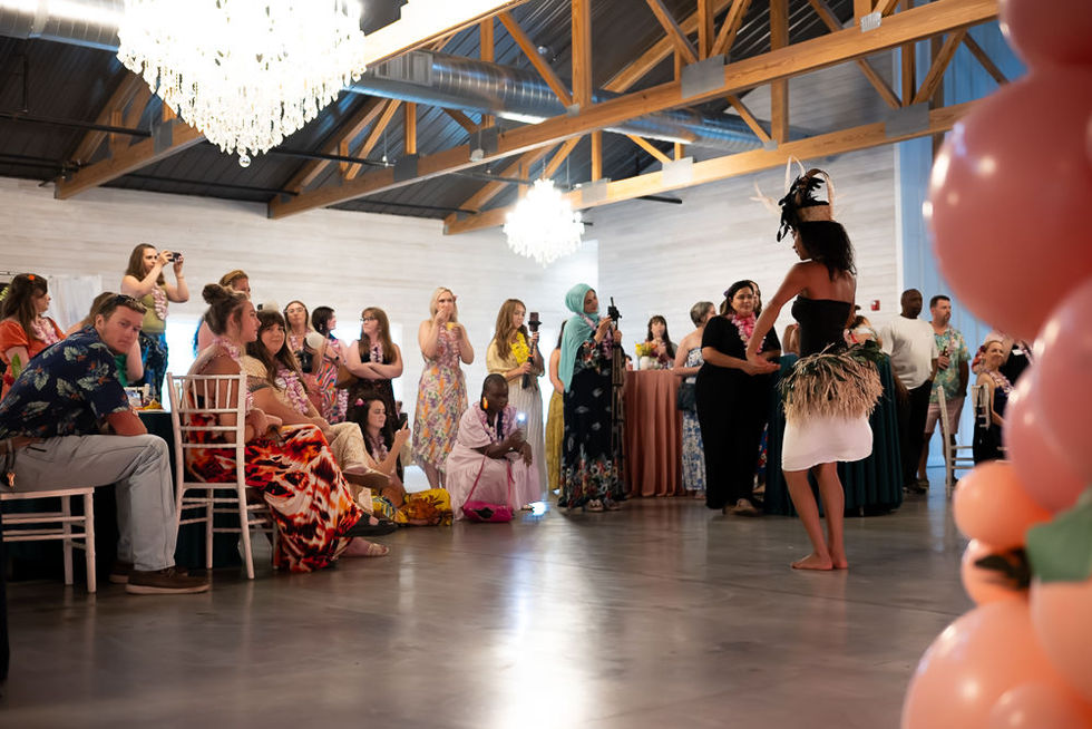 A dancer performs in front of an excited group of Kansas City wedding vendors.