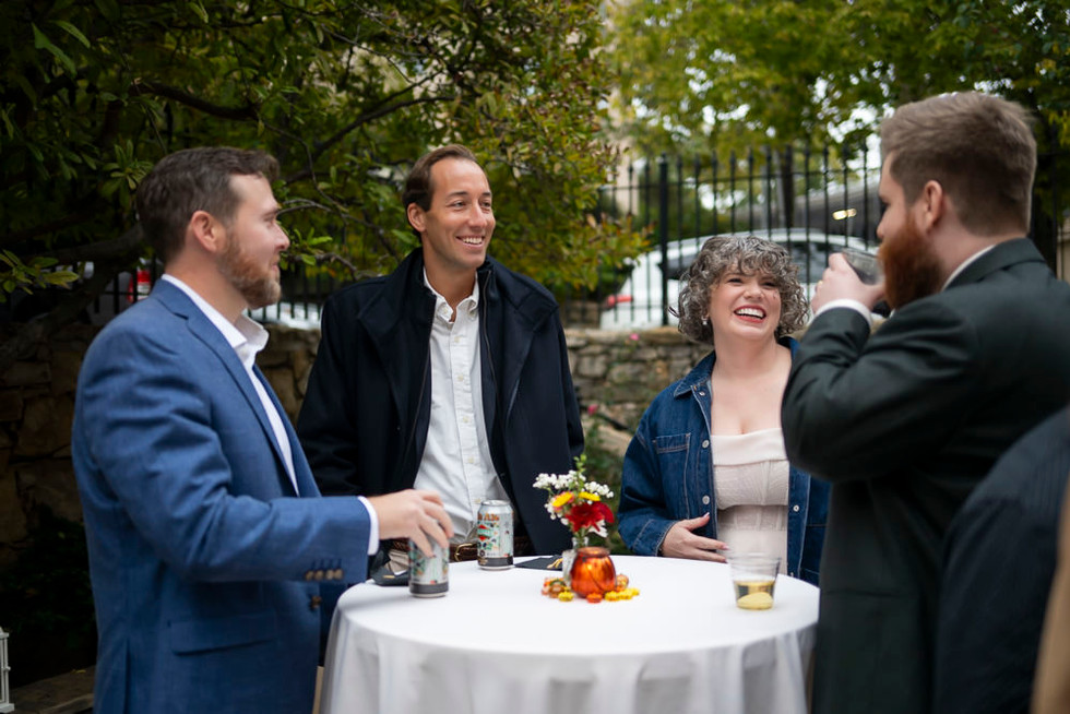 Bride and groom talking with guests after wedding in Kansas City
