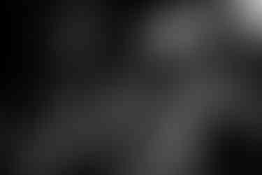 violonist in the background and woman with very expressive face in the foreground