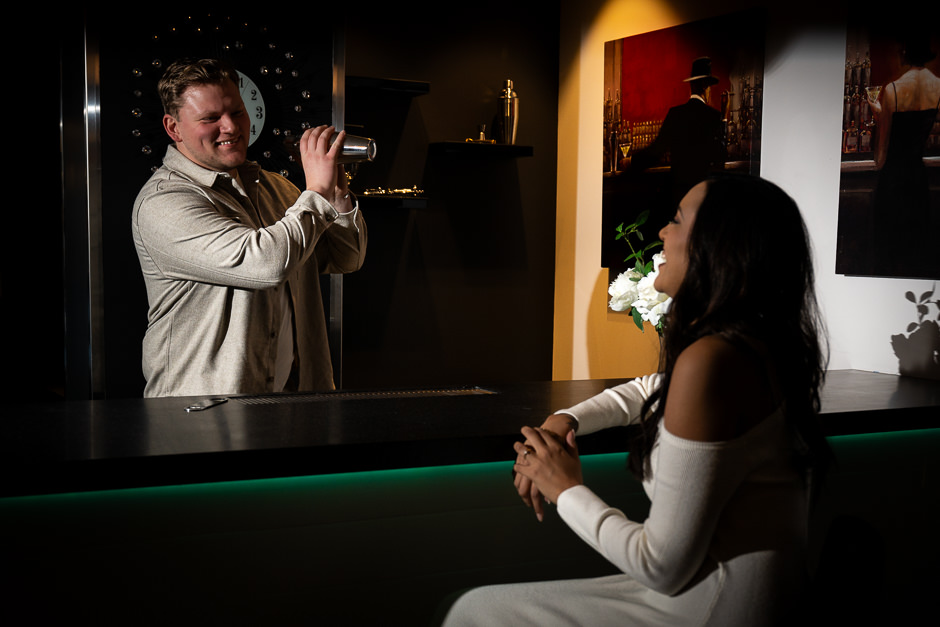 Guy mixing a drink for his fiance at the Warren Place Venue bar