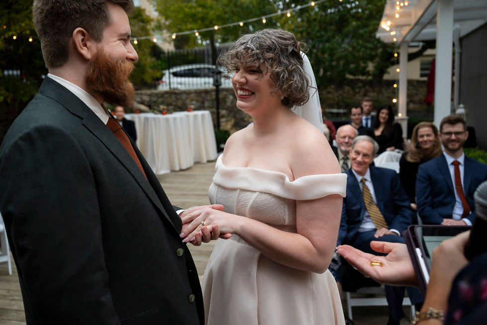 Bride and groom laughing during wedding ceremony in Kansas City