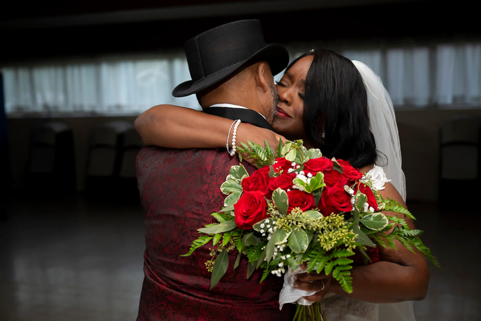 bride and groom hugging after ceremony
