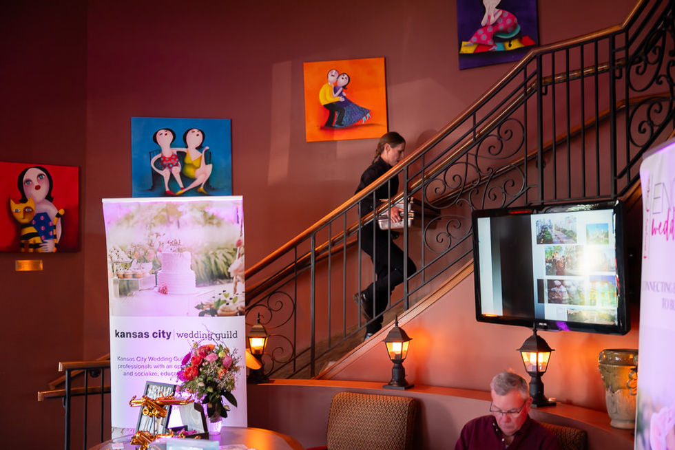 Interior staircase at Piropos with colorful artwork and a waitress climbing the stairs