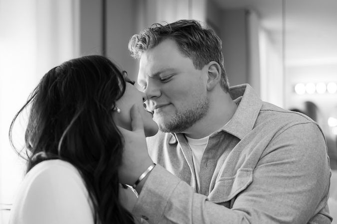 Cute couple getting ready to kiss at engagement pictures