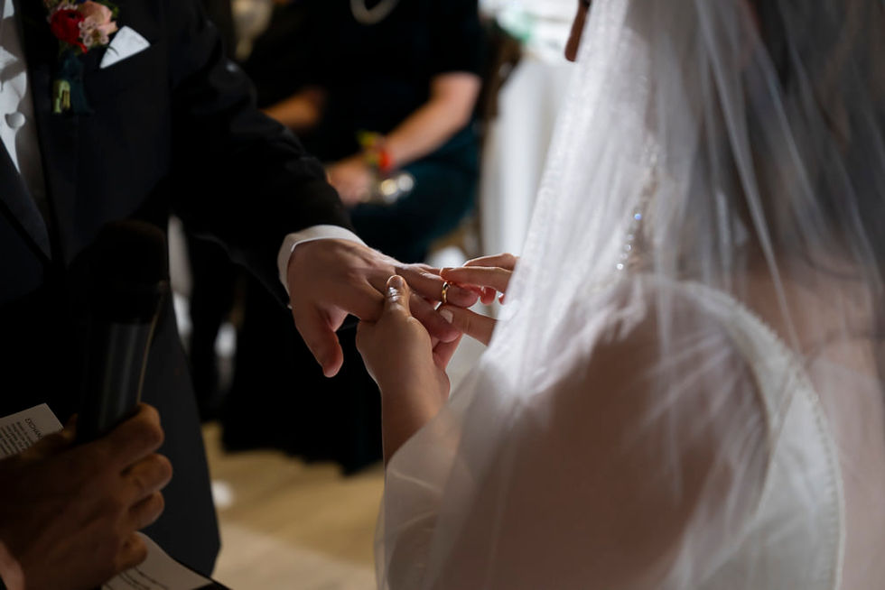Close-up of hands during the ring exchange at Lone Summit Ranch wedding ceremony
