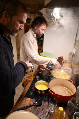 Two men cooking.