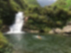 Man diving into a waterfall