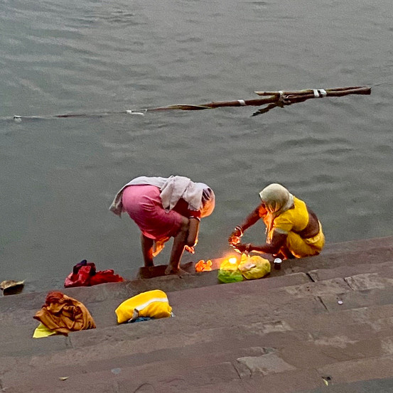 Ladies burning Dias at the Ghats in Banaras India