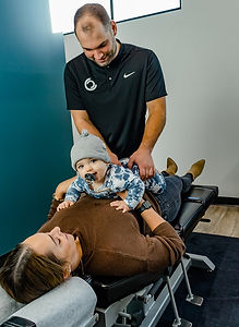 Dr. Jesse Gillham adjusting a postnatal patient in Core Chiropractic