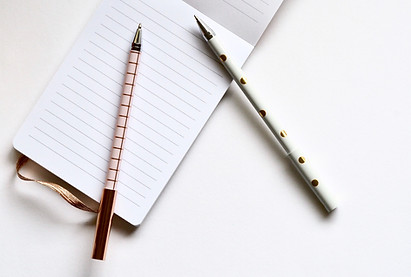 Two Pens on Notebook