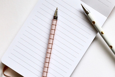 Two Pens on Notebook