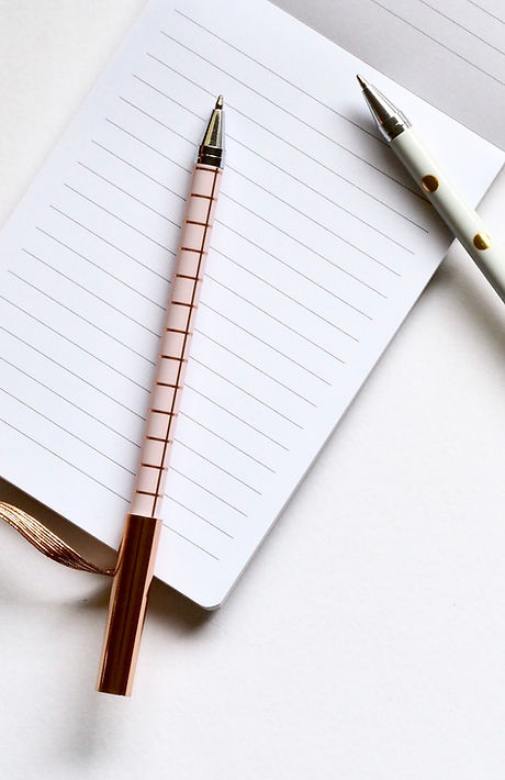 Two Pens on Notebook