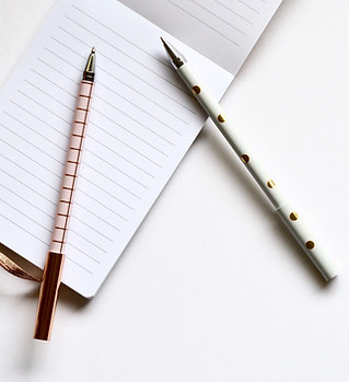 Two Pens on Notebook