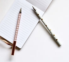 Two Pens on Notebook