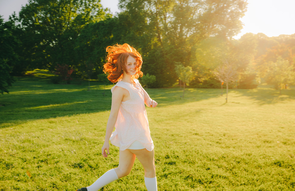 girl running in grass