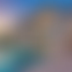 Modern luxury villa in Dubai Hills featuring an infinity pool, elegant outdoor lounge, and scenic mountain view at sunset.