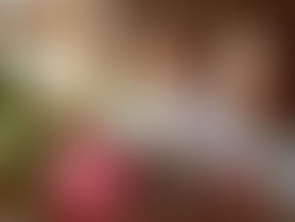 Professional nanny in Riyadh helping a baby with early learning and creative activities.