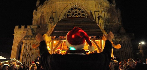 Colin Rea conducting Big Noise Chorus outside Exeter Cathedral