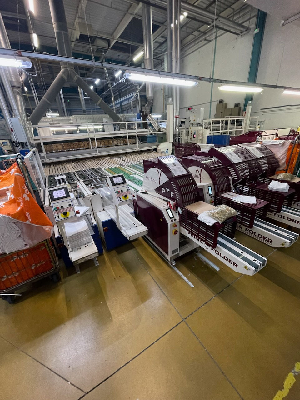 XPB-SYSTEMS-Installation-intégration-machine-blanchisserie-industrielle-plieuse-primafolder