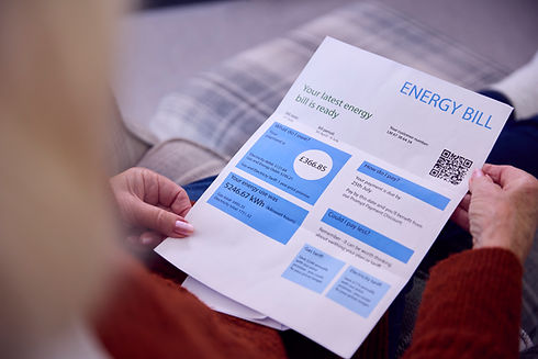 close-up-of-senior-woman-at-home-looking-at-energy-2023-11-27-05-15-00-utc.jpg