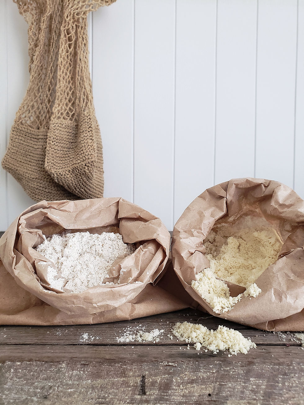 almond meal and flour in brown paper bags