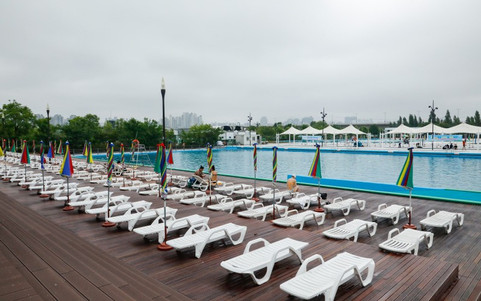 Yeouido Swimming Pool 여의도수영장 Seoul Hangang park pool and swimming in South Korea Park Gwangjin with tents and umbrella during summer season Sogang Bridge