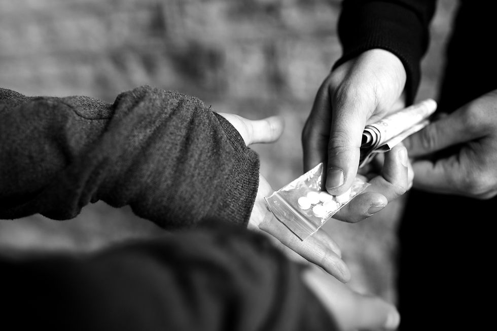 drug-trafficking-crime-addiction-sale-concept-close-up-addict-with-money-buying-dose-from-