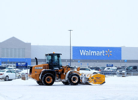 National Snow clearing a 500-car parking lot for Walmart during peak winter months