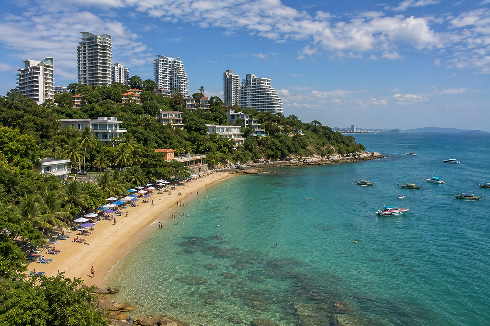 Pratumnak Beach in Pattaya with sandy coastline, swimmers, palm trees and hillside hotels and condominiums