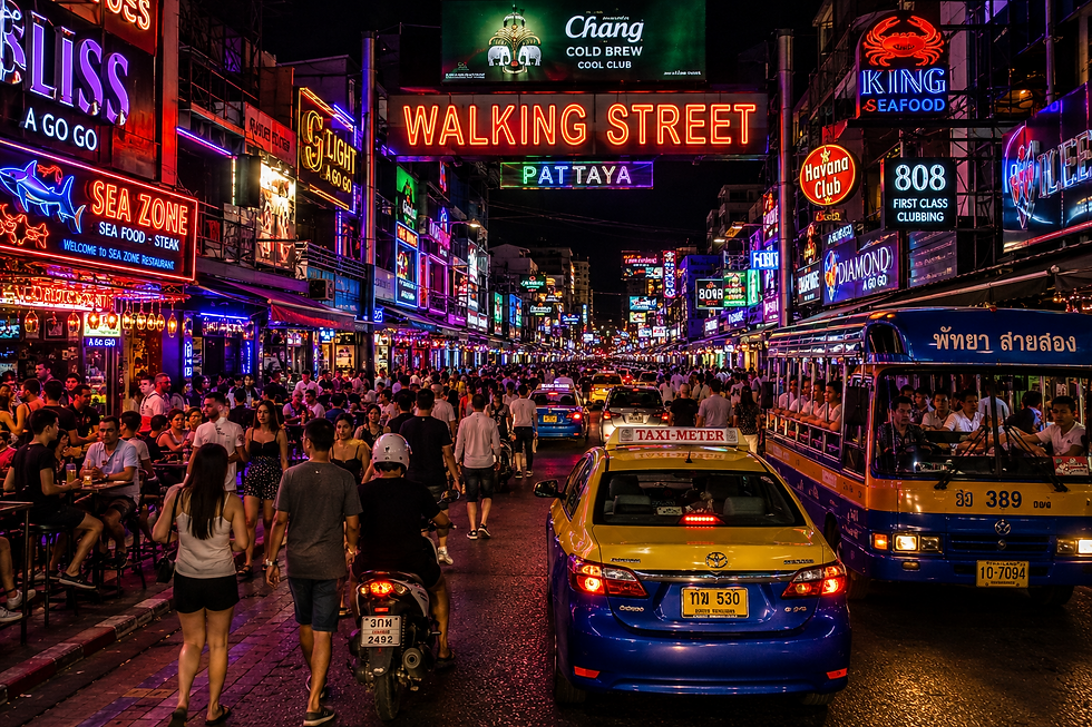Pattaya nightlife getting busy at night with illuminated bars and crowds