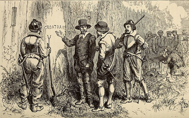Men in 16th-century attire examine "CROATOAN" carved on a tree; rifles and a rustic settlement visible, creating a mysterious atmosphere.