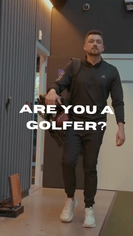 Golfer walking into a golf simulator 