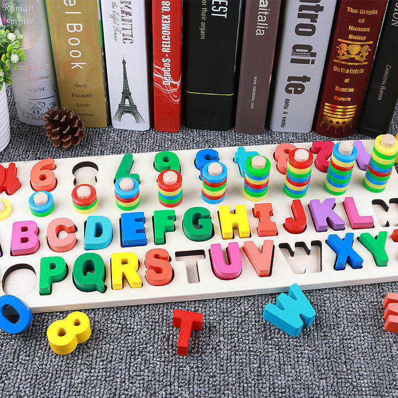 Colorful alphabet and number sensory jigsaw board on a desk.