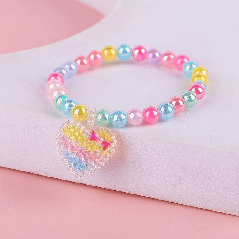 Thumbnail: Colorful beaded bracelet with a heart charm, playful accessory for kids.