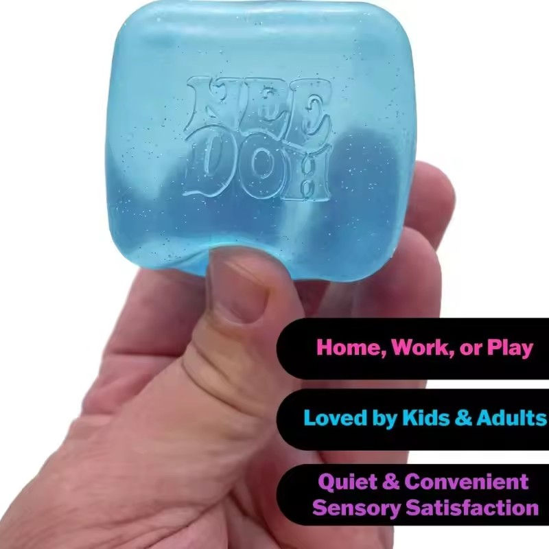 Thumbnail: Blue NeeDoh Nice Cube sensory toy held in a hand.