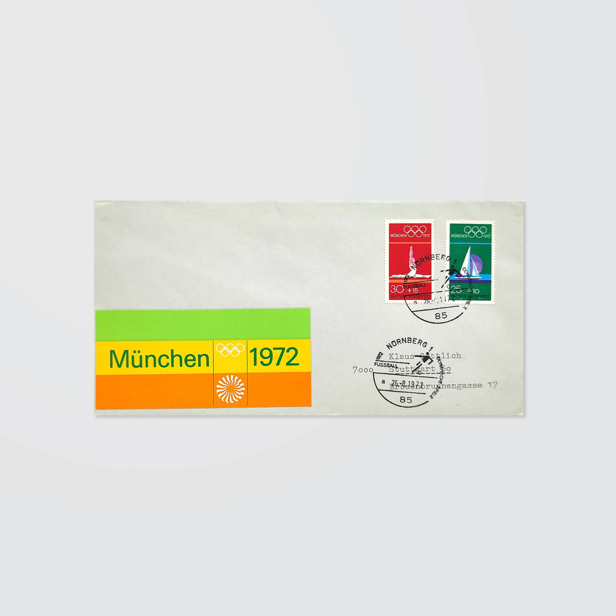A stamped envelope with special postmarks and a colourful striped logo sticker for the Munich 1972 Olympics 