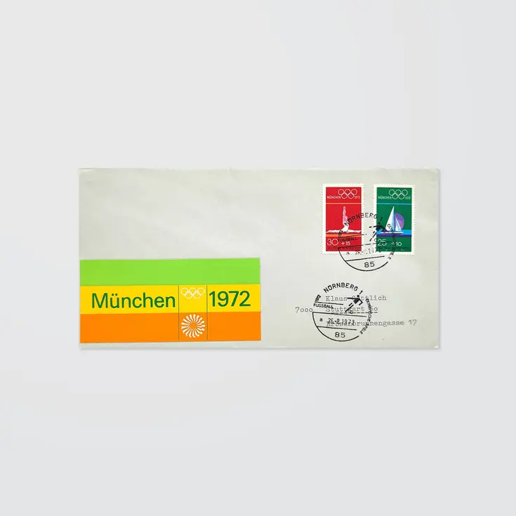 A stamped envelope with special postmarks and a colourful striped logo sticker for the Munich 1972 Olympics 