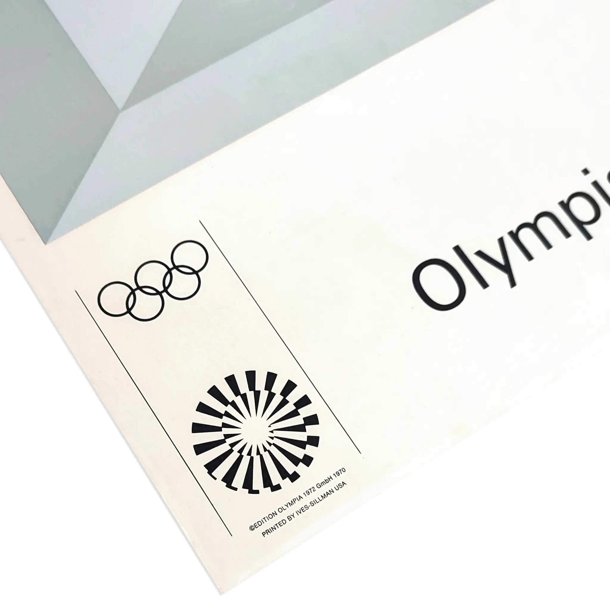 Olympic rings and geometric design on a poster. Text includes "Olymp" and printing details. Monochrome with a modern, minimalistic look.