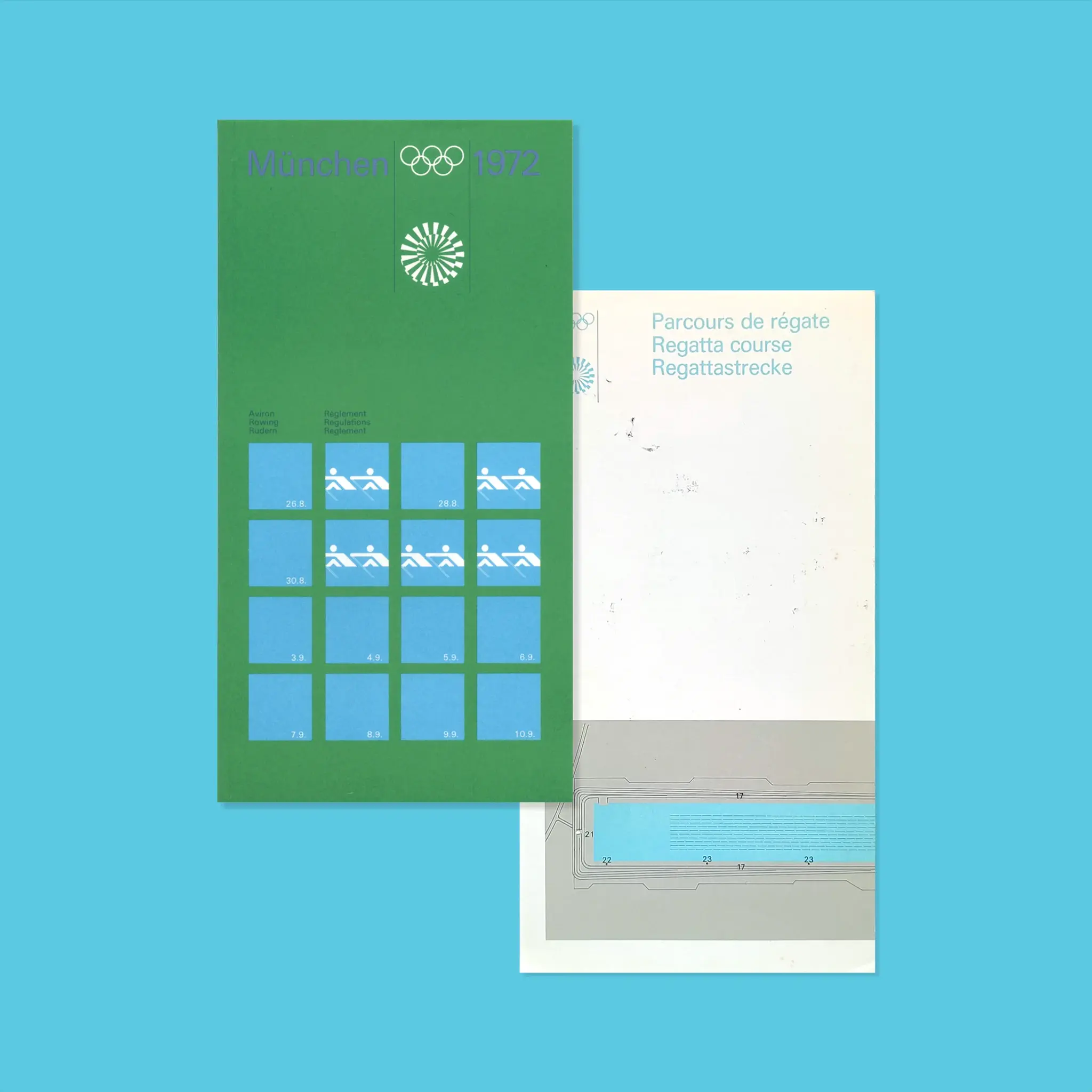 Green booklet with "München 1972", "Rowing Regulations" and Olympic icons, along with a white site map with multilingual text