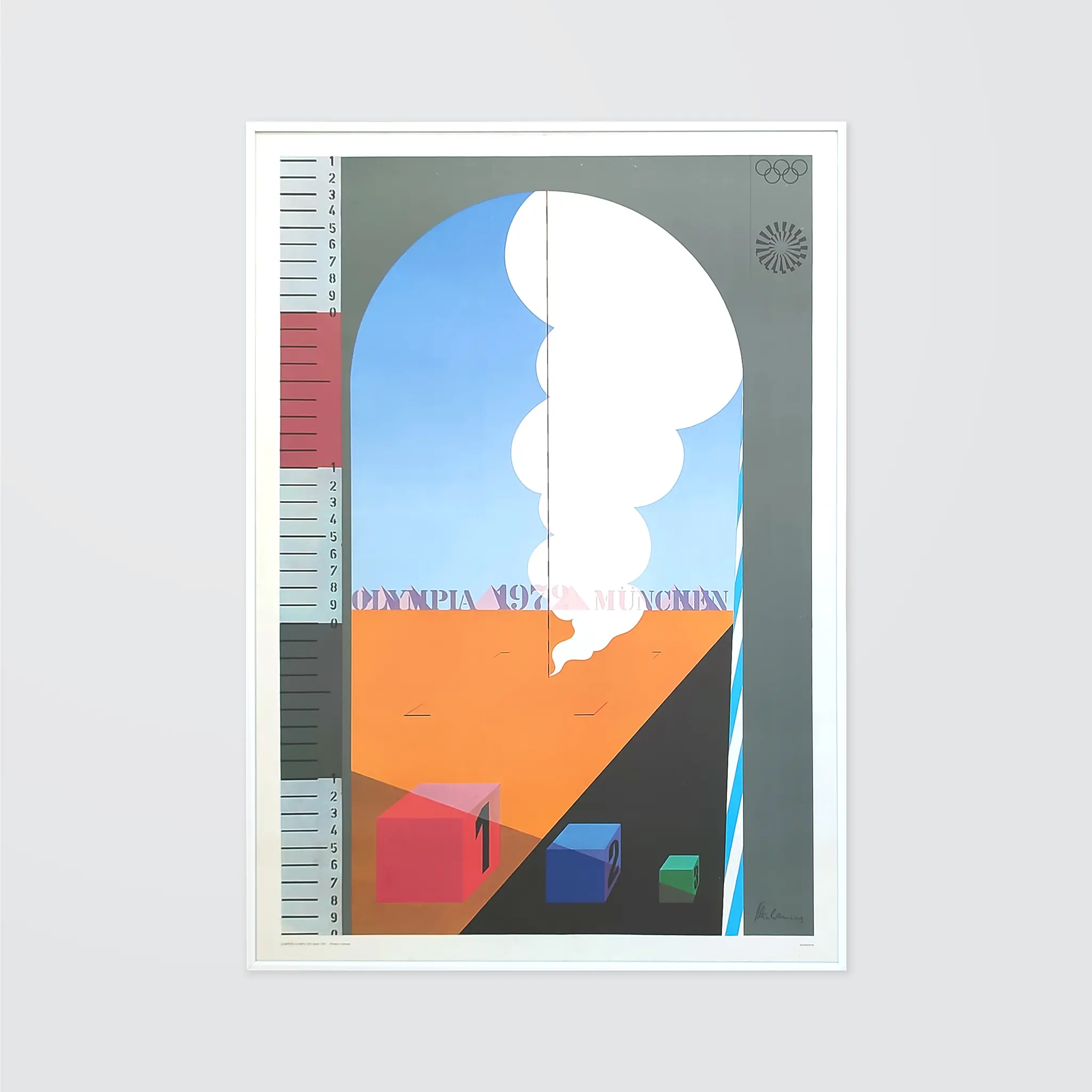 Poster with geometric shapes, clouds, and podium in desert. Text reads "Olympia 1972 München." Olympic rings and ruler on sides. Blue sky.