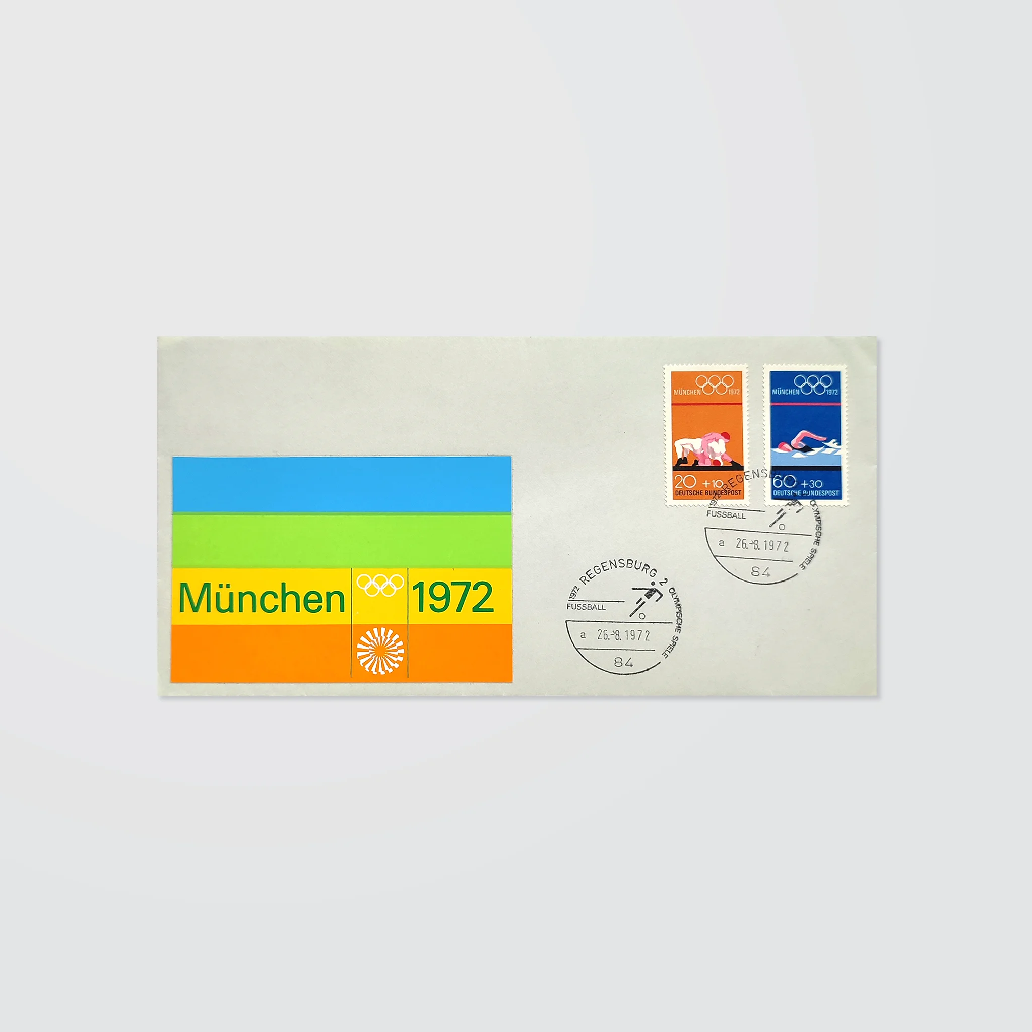 A stamped envelope with special postmarks and a colourful striped logo sticker for the Munich 1972 Olympics 