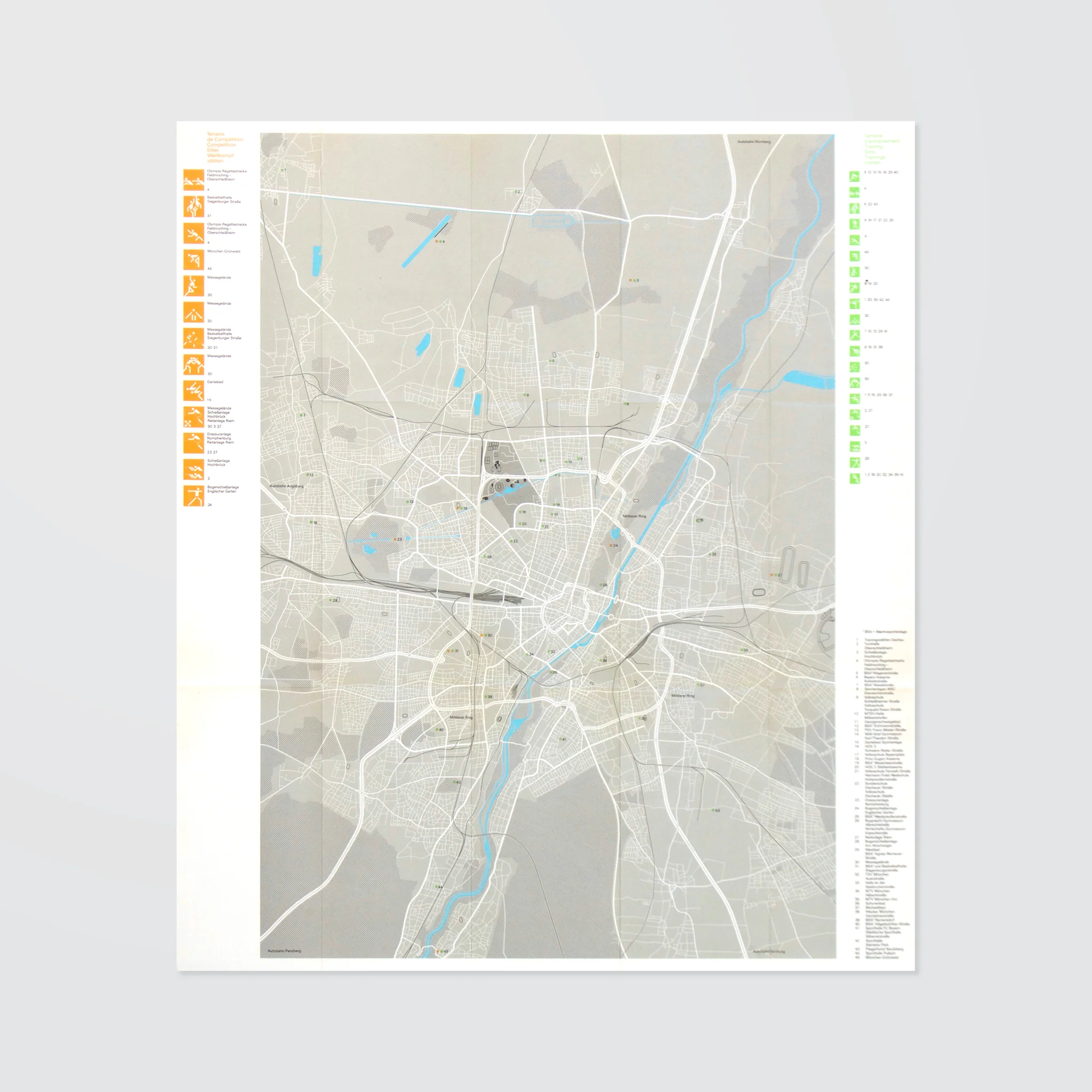 City map with blue waterways and gray roads. Icons and text on sides. Neutral tones, detailed layout of urban area.