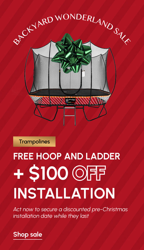 Best in Backyards holiday trampoline sale banner showing a safety-net trampoline with a green bow, offering a free hoop and ladder plus $1,000 off installation for the Christmas season.