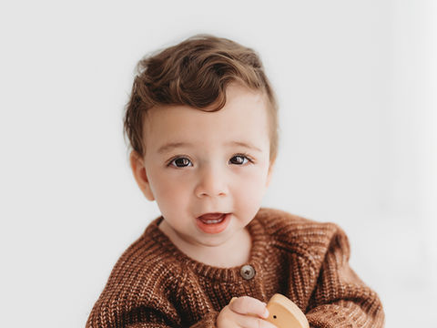 Sitting baby in photoshoot taken by Haywards Heath Photographer