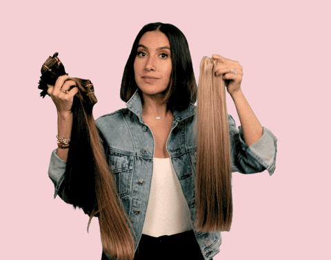 Woman comparing hair extensions.