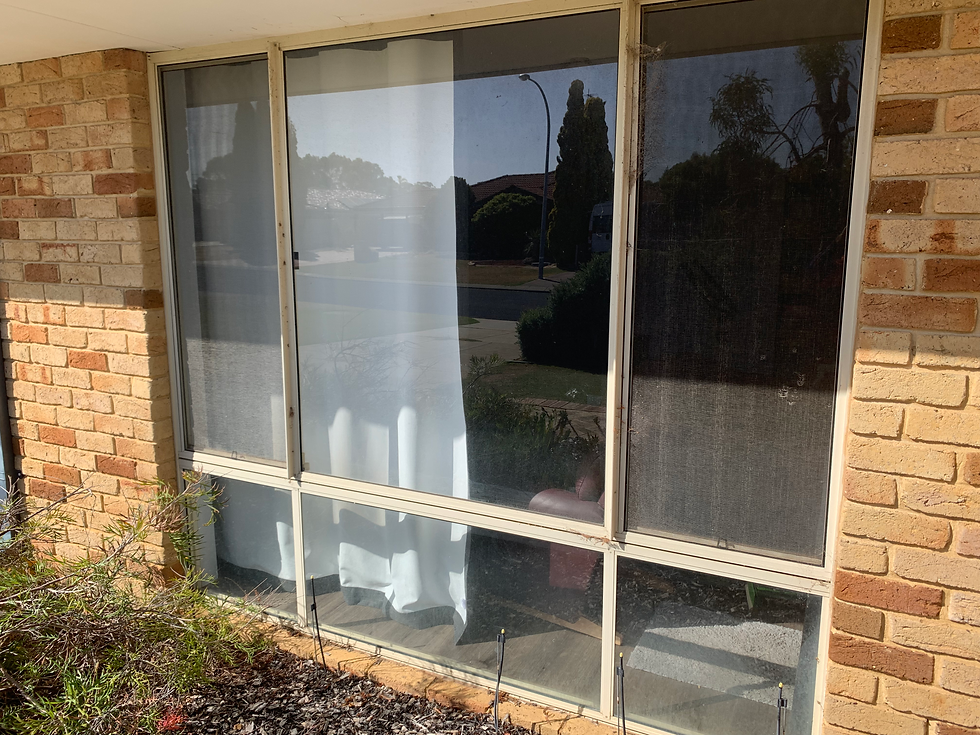 Front window that is dirty and about to be cleaned