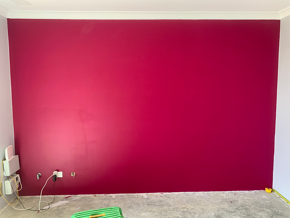 Red feature wall recently painted with good coverage