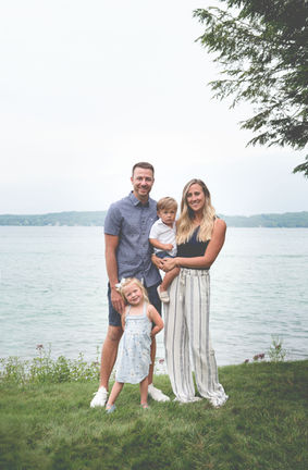 family portrait in front of Lake Michigan in glen arbor